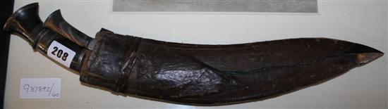 19th century kukri in leather scabbard(-)